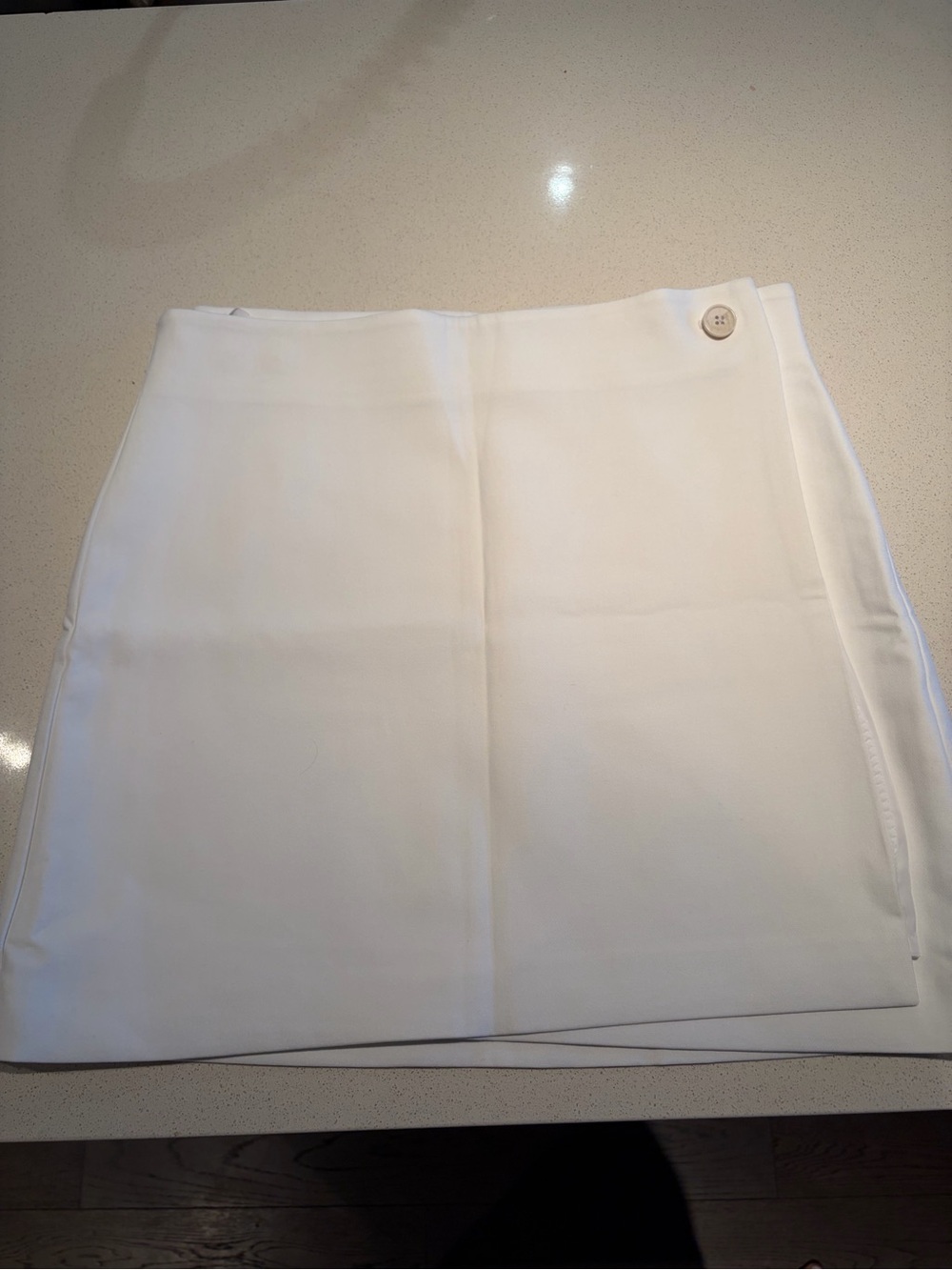 Babaton White Mini Wrap Skirt with Button